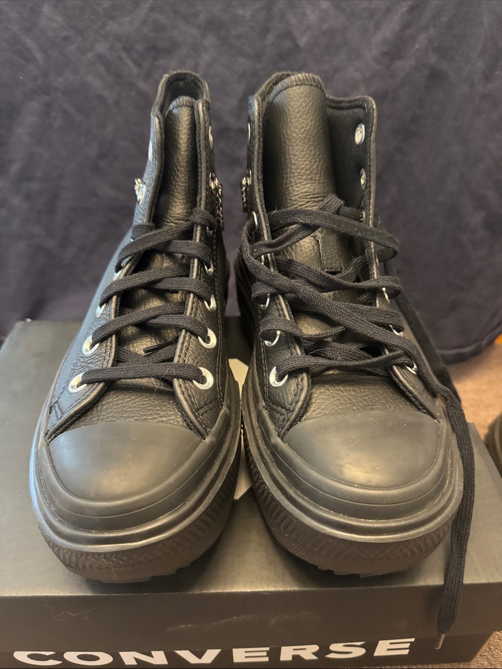 Black High-Top Leather Converse sneakers,